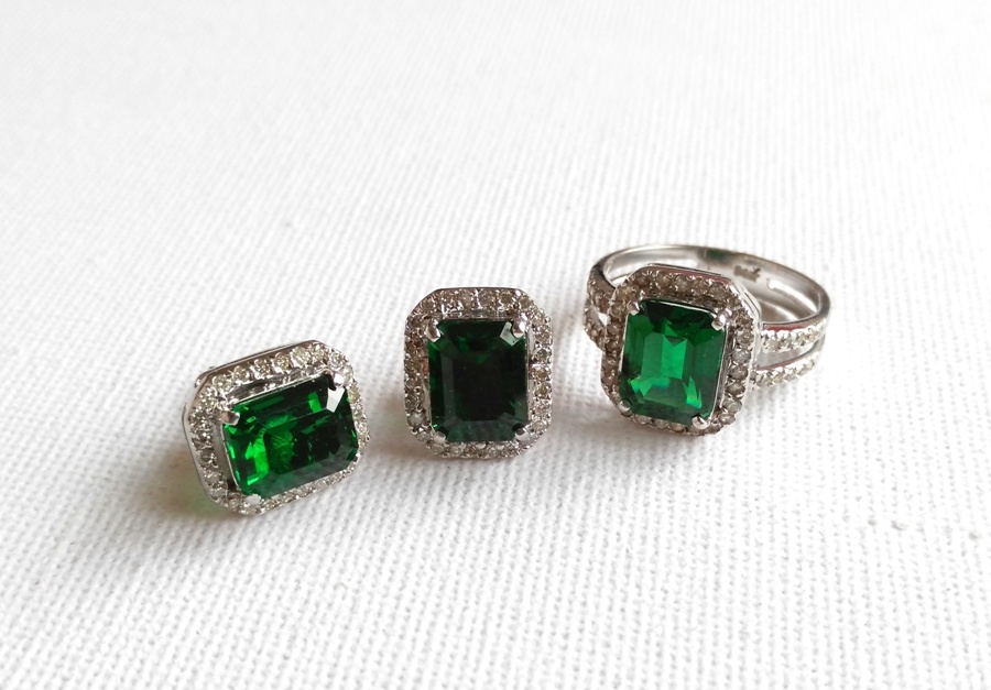 The beautifully designed emerald ring comes with matching pair of earrings. Inquire for price at dbrightspot@gmail.com.
